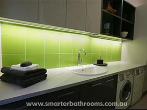 Green tiles with white grout. Smarter Bathrooms Melbourne