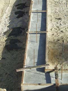 Concrete strip footings with reinforcement