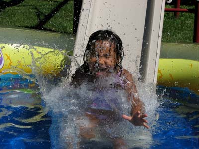 Girl sliding into pool